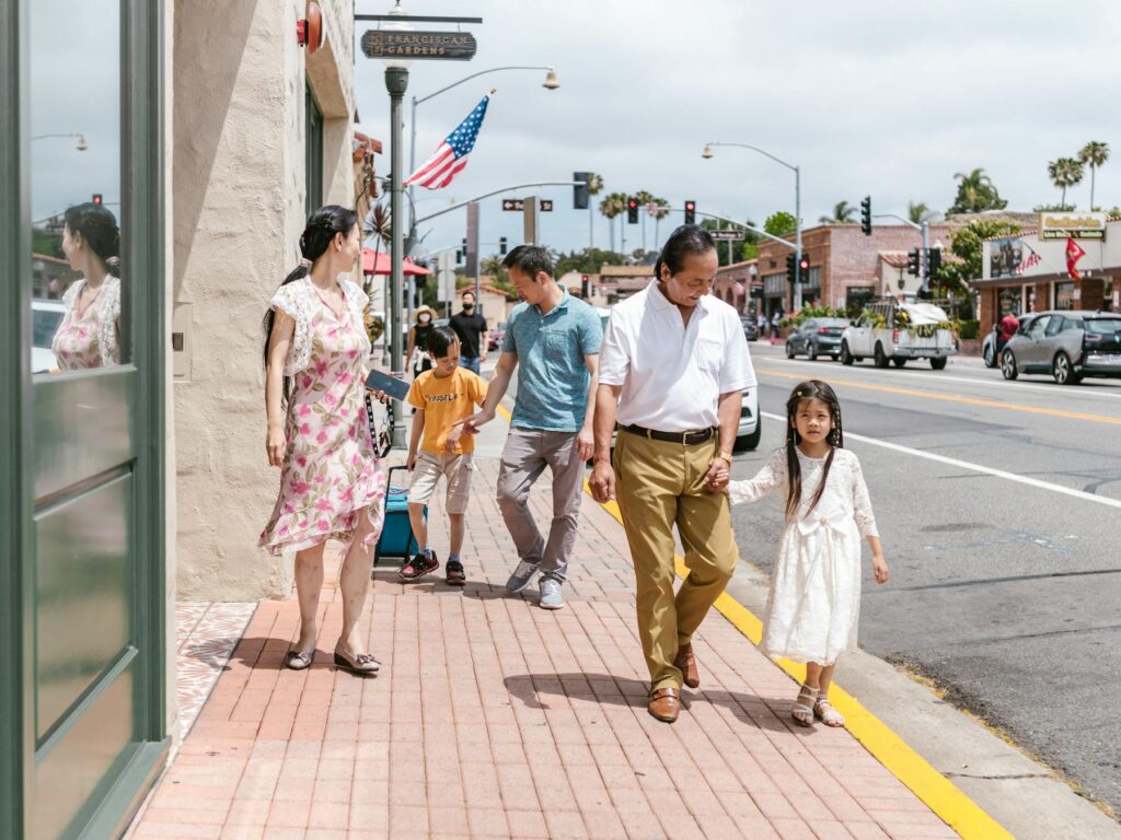Family walking on a sunny downtown street