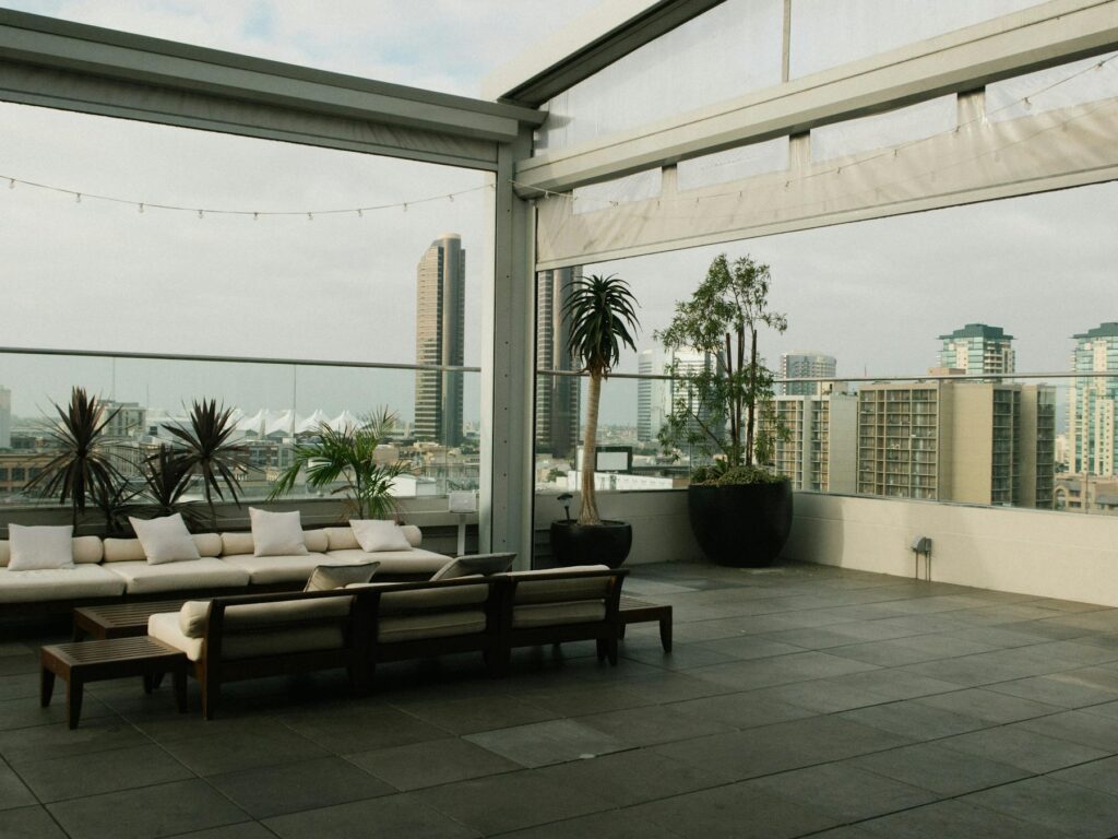 Rooftop lounge with city view and plants