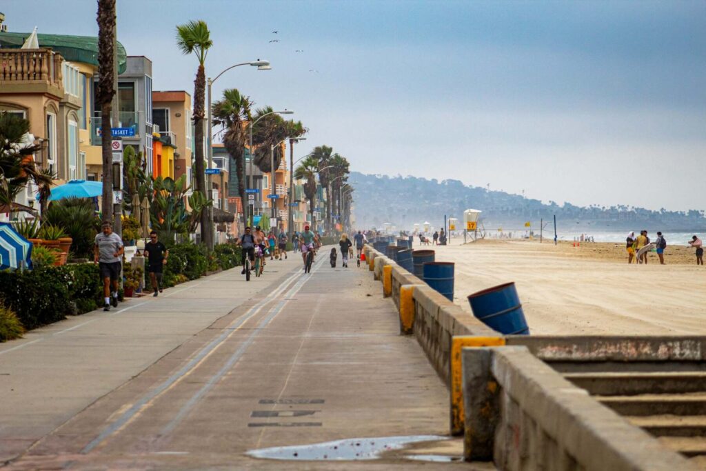 Ocean Beach boardwalk with palm trees in San Diego